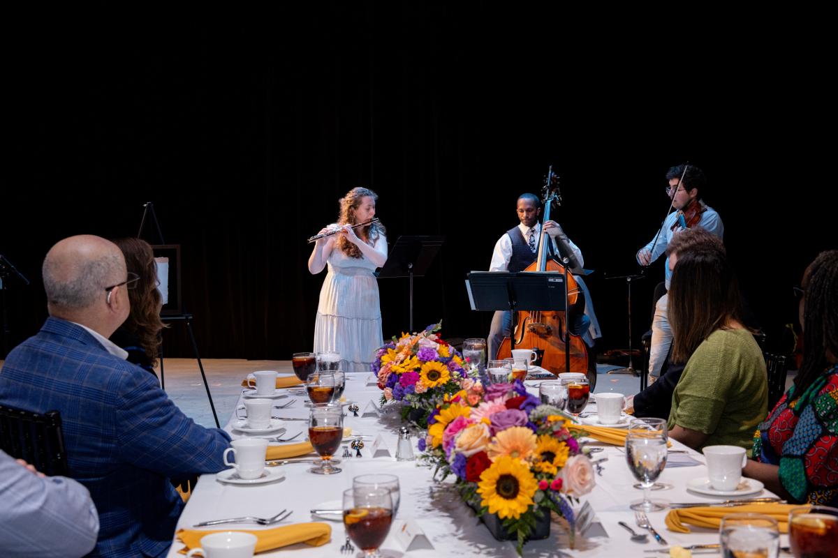 Courtney Adams, Joshua Rhodes, and Seth Goodman perform "Concertino for Flute, Viola, and Double Bass" at the Sadat Arts for Justice and Peace Luncheon.