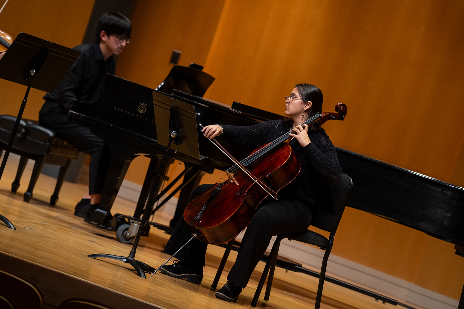 Image of a student performer playing cello.