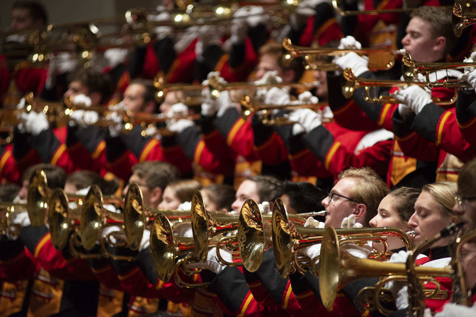 Student band members play an array of instruments during a performance.
