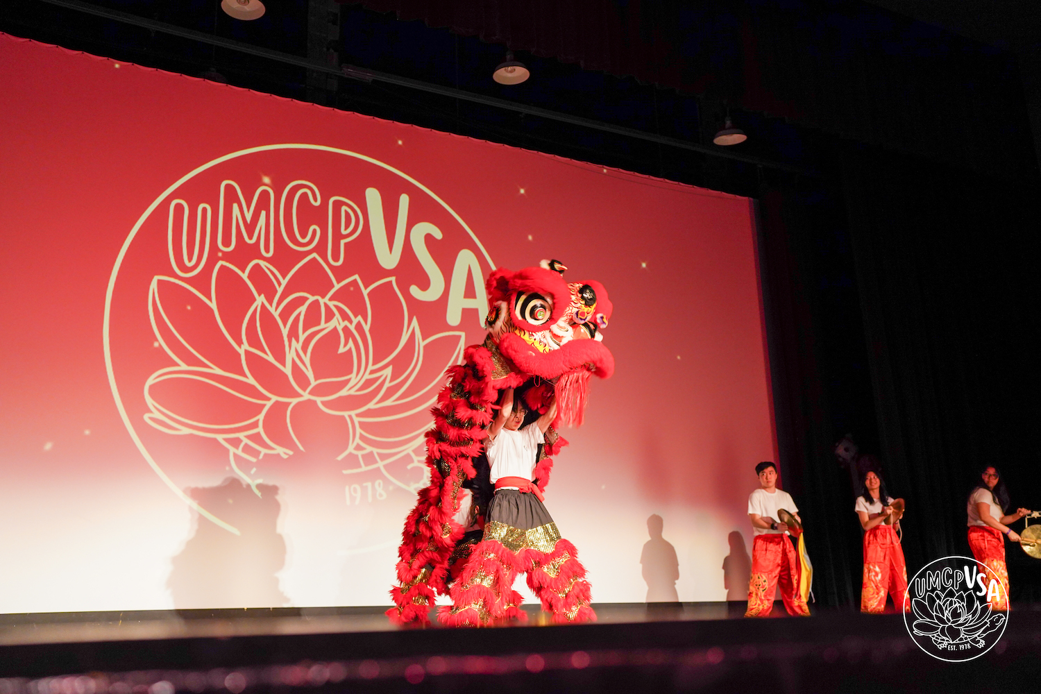 Members of Terp Lions perform on stage.