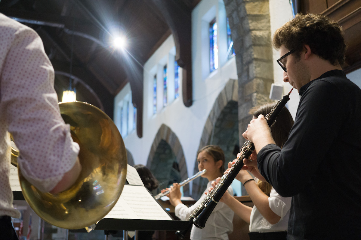 NOI Fellows play instruments during a concert at St. Andrews.