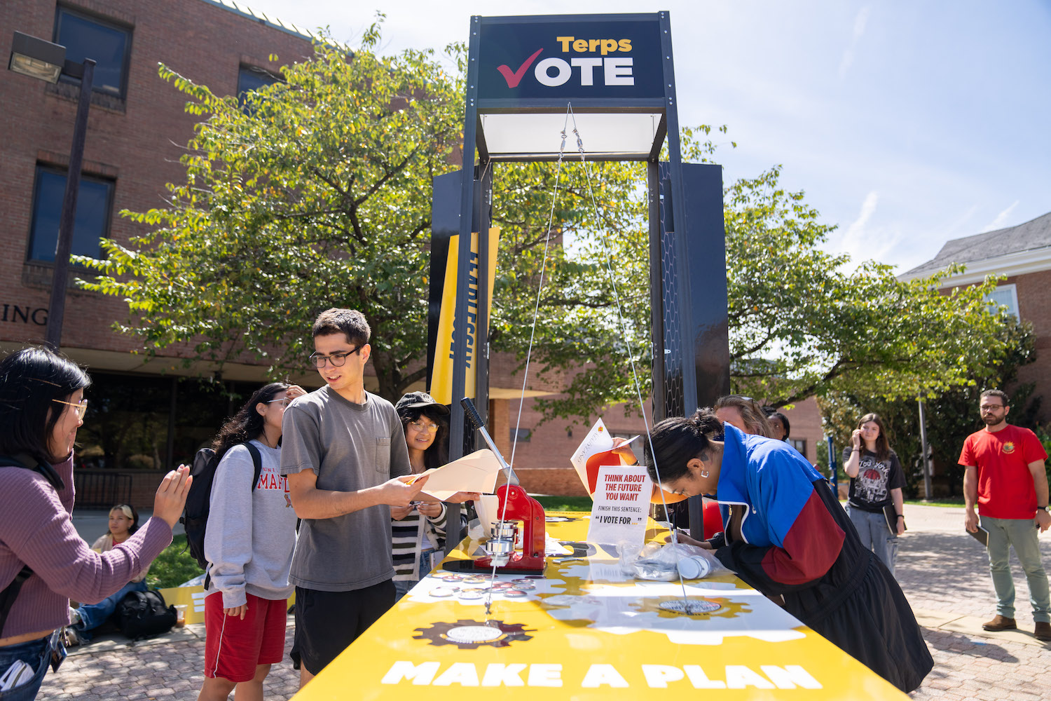 Students gather around the VOTE (Fearlessly)! pop-up in Tawes Plaza.