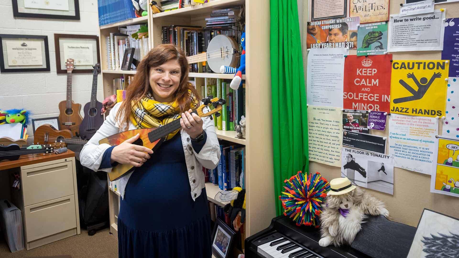 Assistant Professor of music education Robin Giebelhausen plays her ukulele.