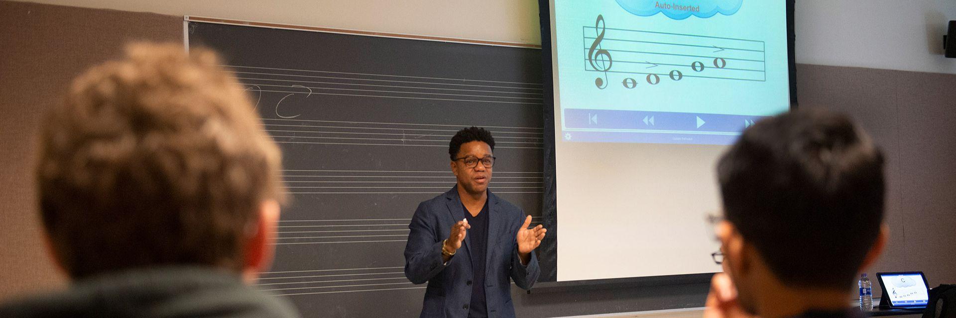 A music professor teaches in a classroom.
