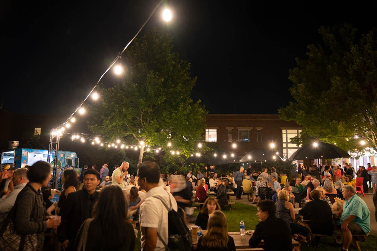 People gather in The Clarice's courtyard and enjoy food and drink.