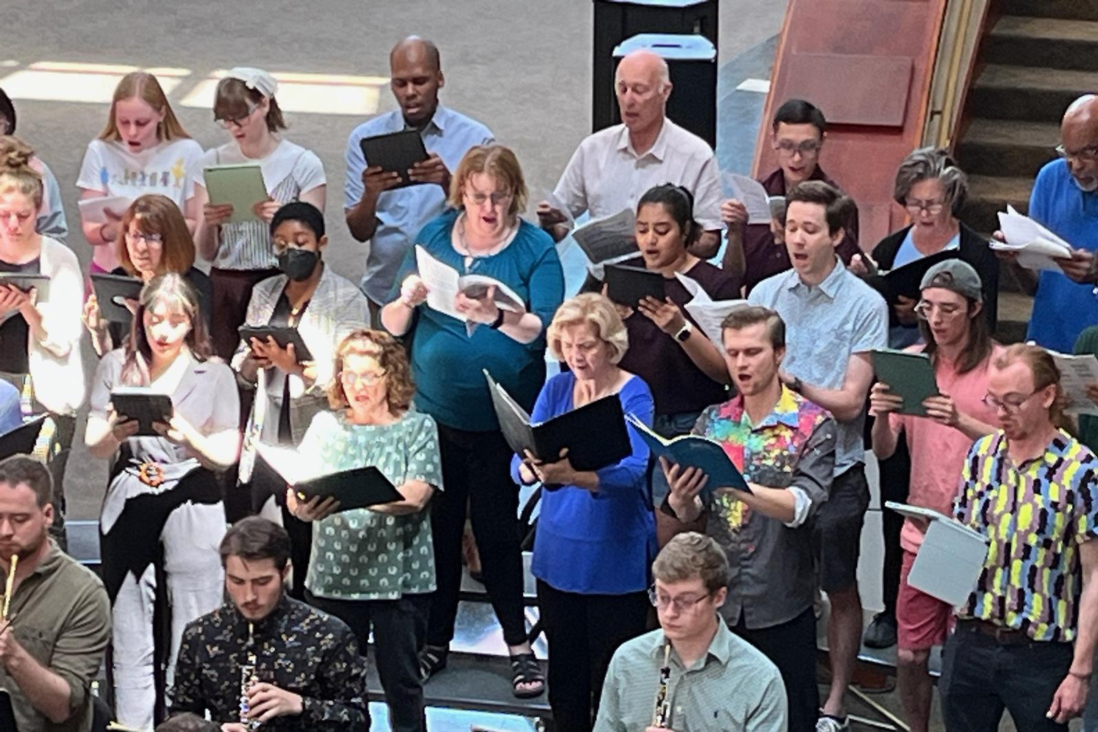 Community members sing together in The Clarice's Grand Pavilion.