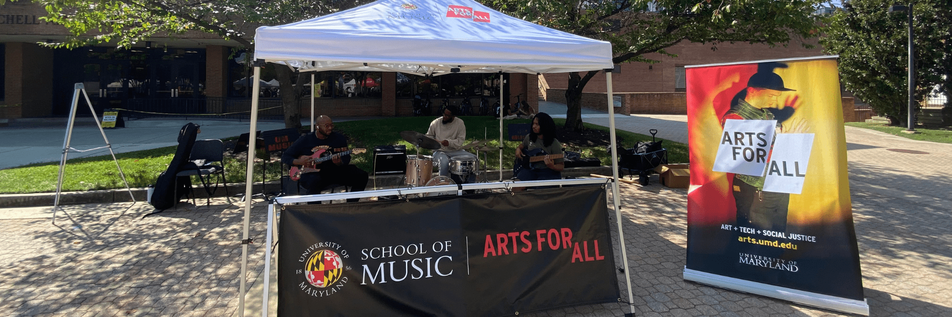 The Jazz Ensemble performs at the Arts for All tent at the Farmers Market.