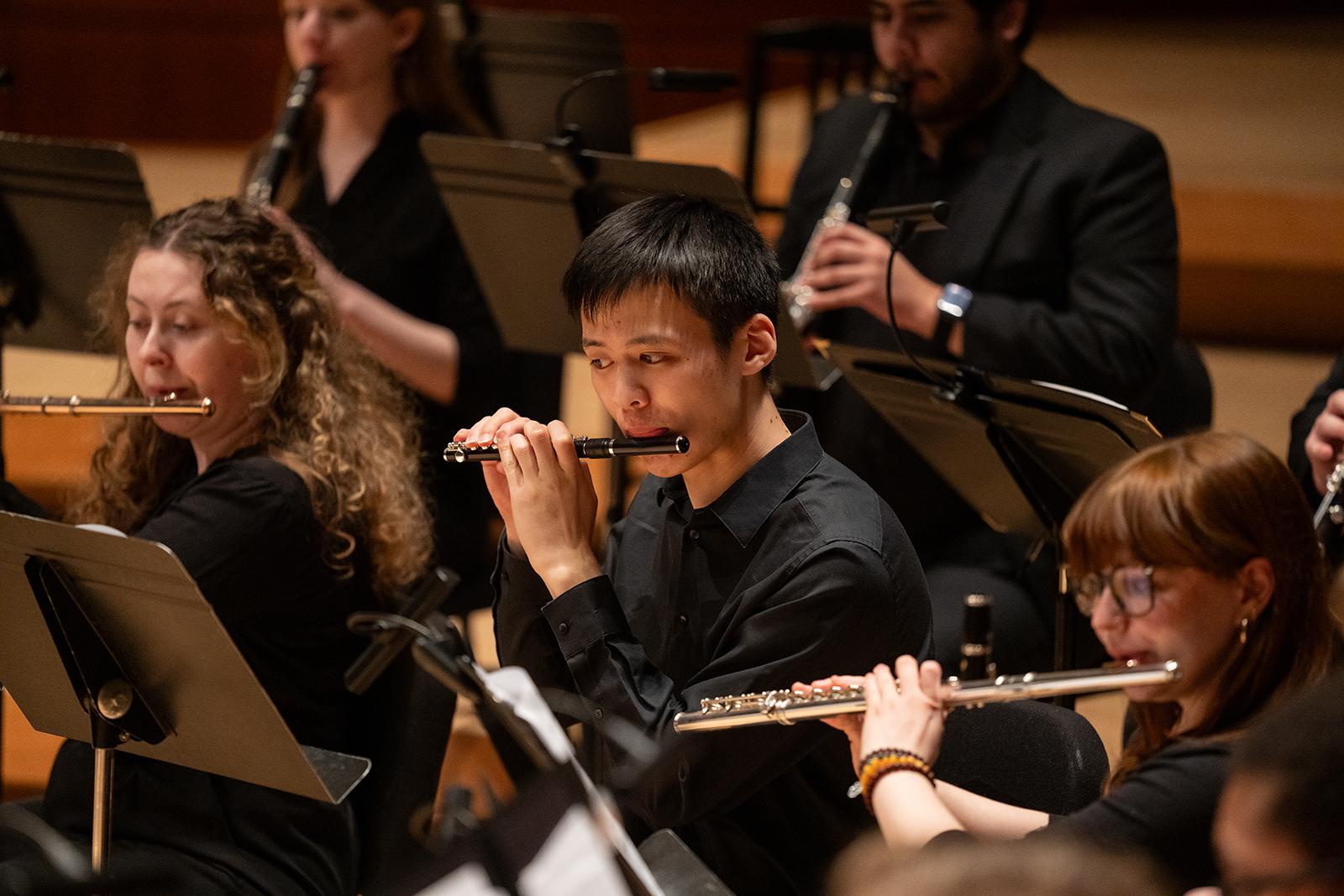 The UMD Wind Orchestra performs on stage.