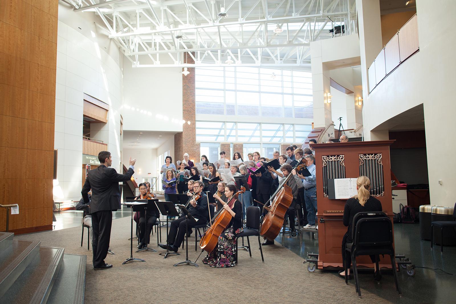 Choir performs in The Clarice lobby.