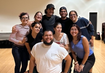 Members of Maryland Latin Dance pose for a photo in a dance studio.